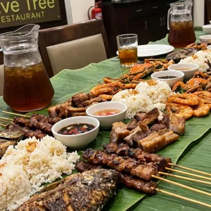 Cajun Or Philippine Islands Seafood Boodle Feast in Dubai | Dubai Travel Tours Cajun Or Philippine Islands Seafood Boodle Feast at Olive Tree at Aavri Hotel Dubai